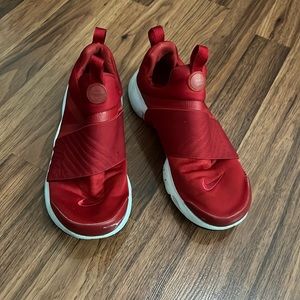 Red Nike no lace running shoes